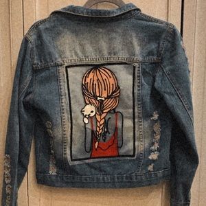 jean jacket with a girl on the back